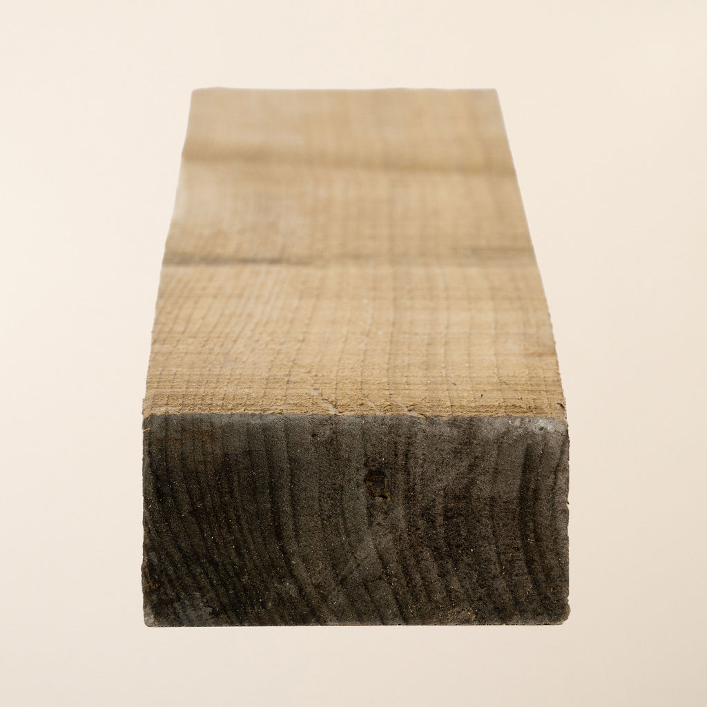 Close-up of 4x2 pressure treated timber showing grain pattern 