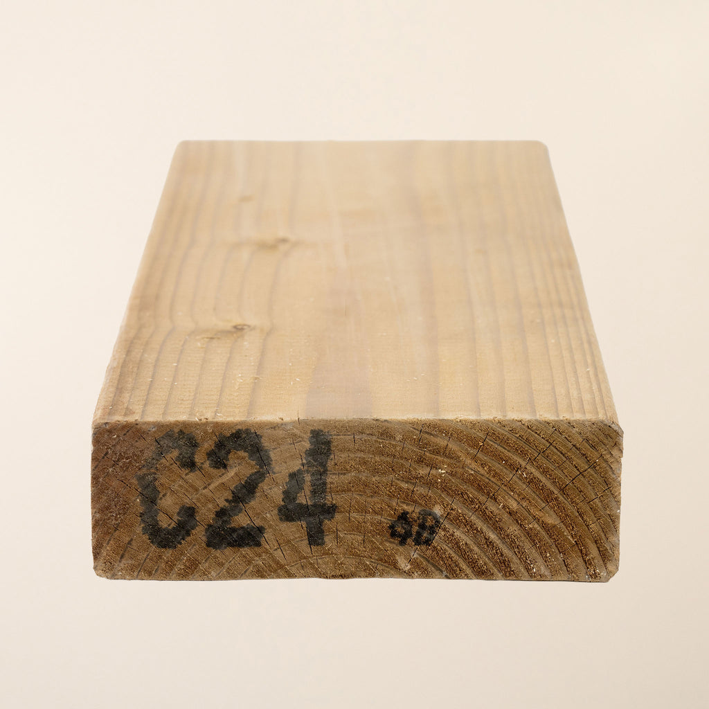 C24 grade 6-inch x 2-inch (145mm x 45mm) Pressure Treated Timber with planed finish, showing the green tanalith treatment that provides long-lasting protection for structural applications 