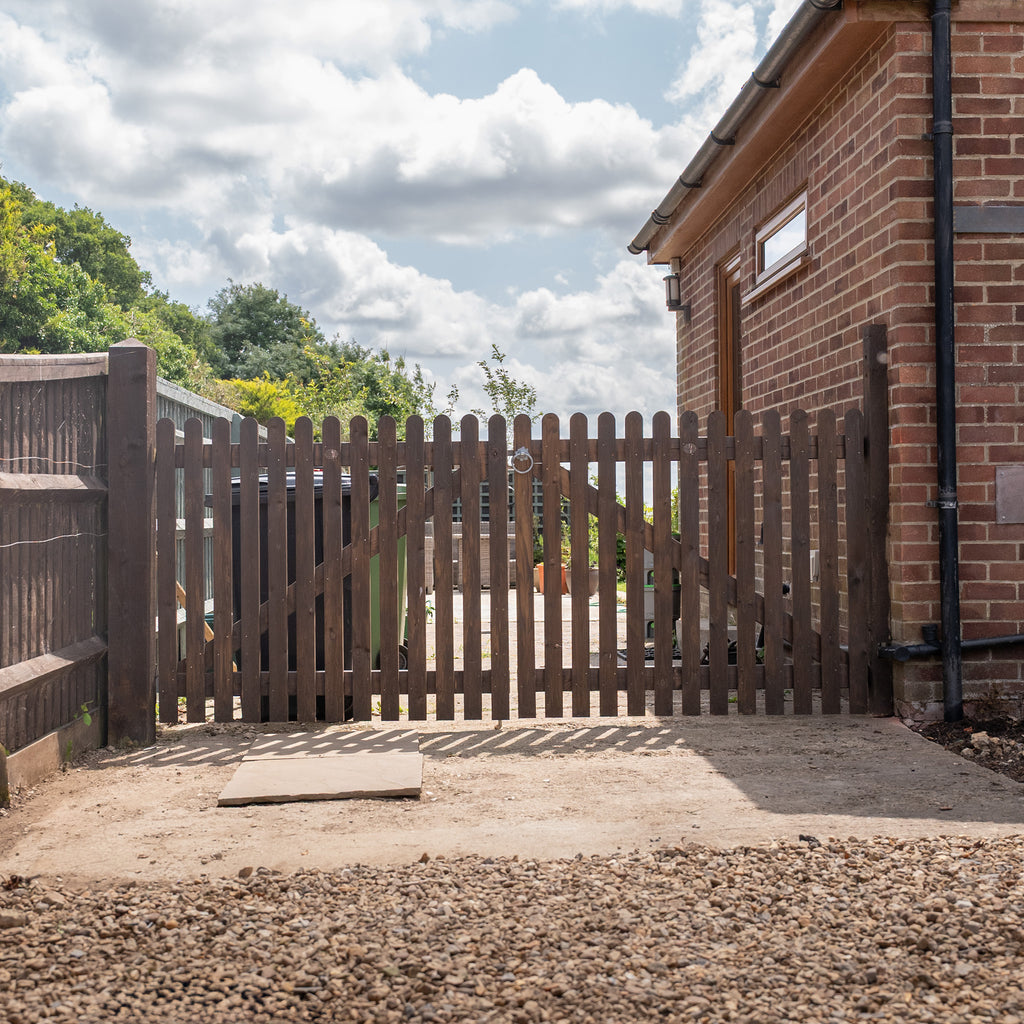 Picket Driveway Gate Pair shown in lifestyle setting 