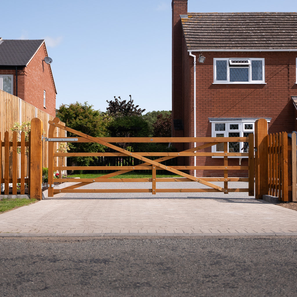 Handcrafted Exbourne gate creating welcoming entrance to residential property, featuring signature curved heel and planed timber construction 