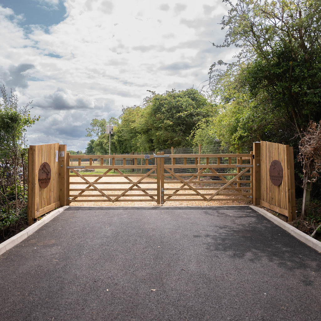 Lifestyle image of Boscastle Diamond Brace Planed gate installed at park entrance 