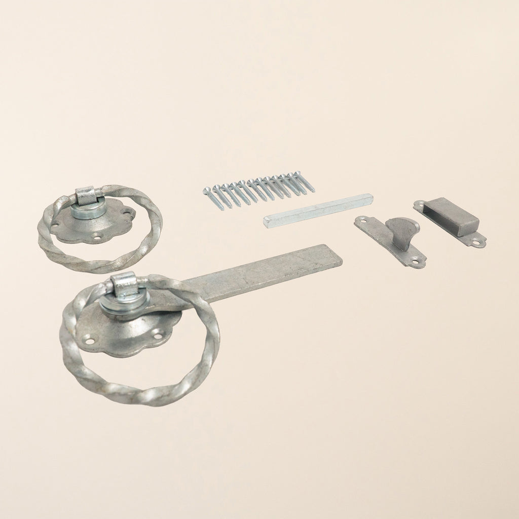 6-inch galvanised twisted ring gate latch featuring heavy-duty construction with cranked latch bar, deep catch mechanism, and looped aluminum ring handle for secure gate closure 