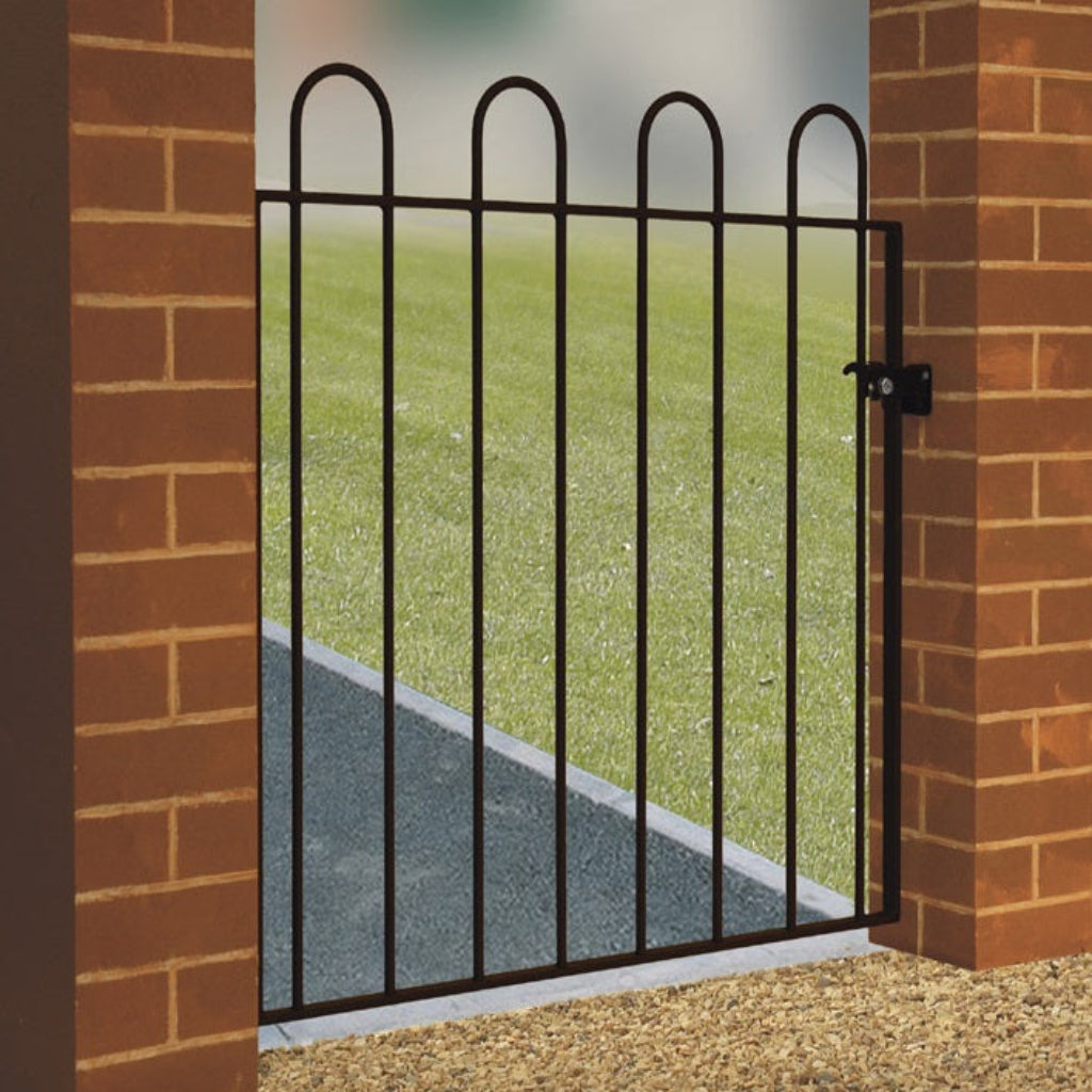 Calstock hoop top garden gate installed in garden setting, showing curved top design and black metal finish 