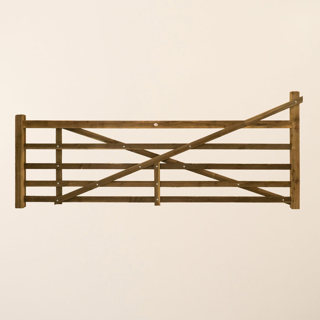 Wooden field gate with horizontal rails and straight heel design, front view 