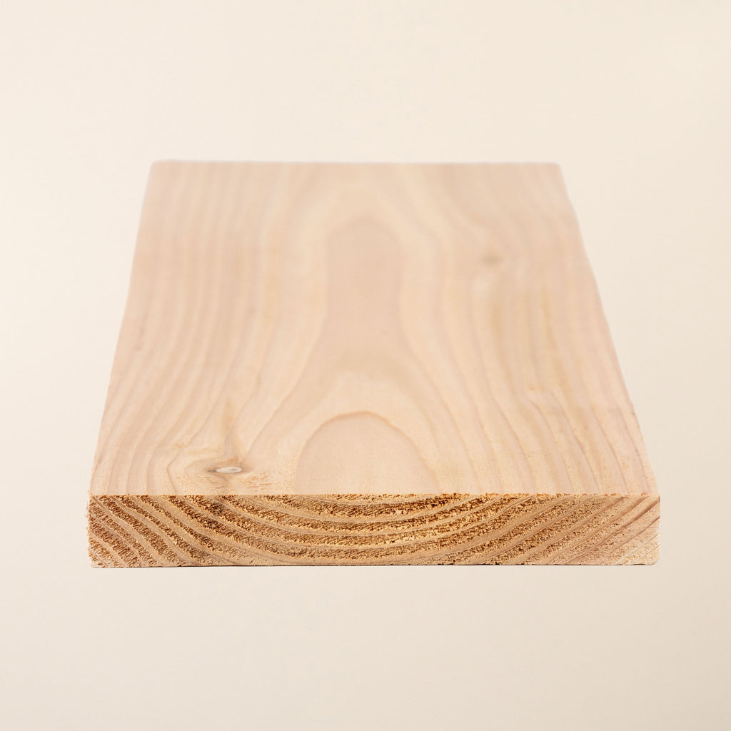 6" x 1" British Cedar board shown in full length, displaying the planed smooth surface and natural wood grain 