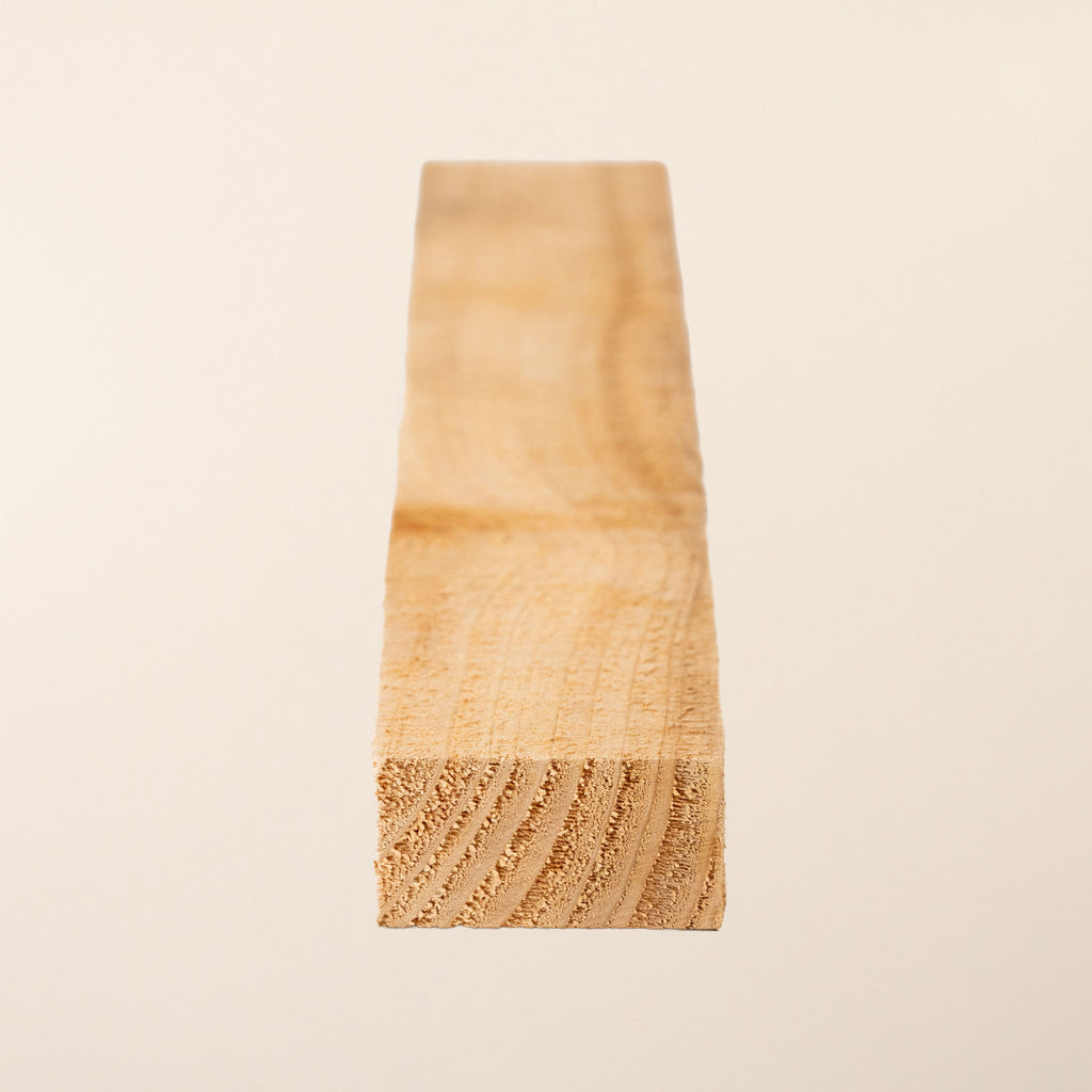 Home-Grown Cedar Rough Sawn 50mm x 22mm boards showing the natural reddish-brown color and texture of the wood 