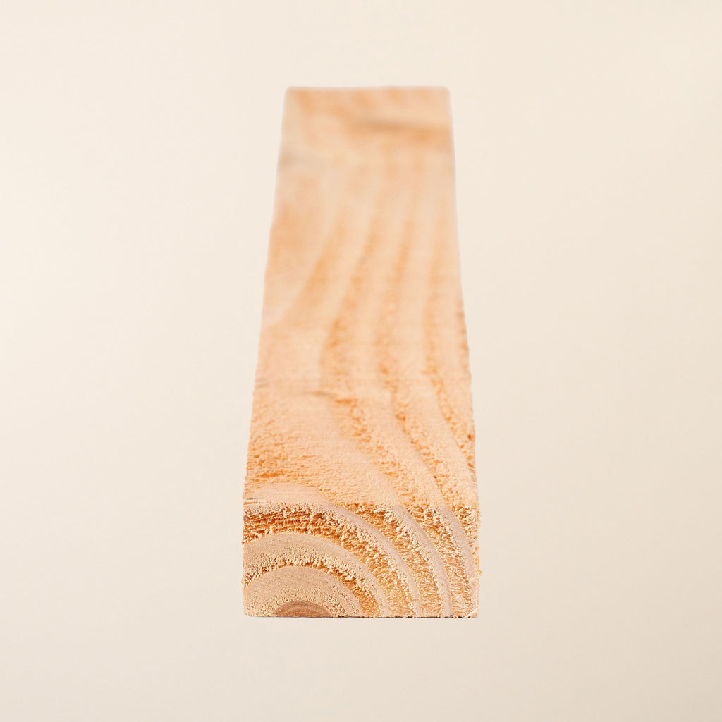 2-inch x 1-inch (50mm x 19mm) Homegrown Larch Boards with rough sawn finish, showcasing the natural rustic texture and warm reddish-brown color of this naturally rot-resistant timber 