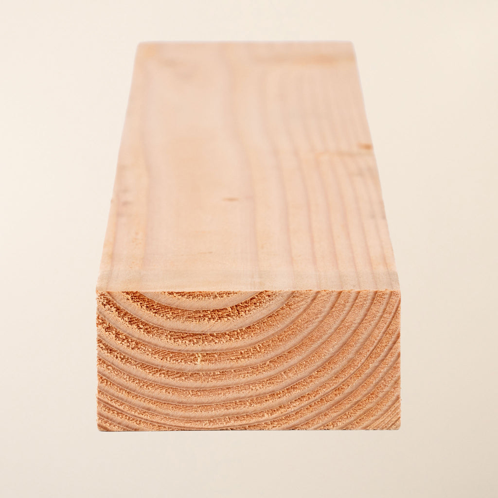 4-inch x 2-inch (95mm x 45mm) Home-Grown Larch Boards with planed finish, showcasing the natural grain pattern and smooth surface of this untreated, naturally durable timber 