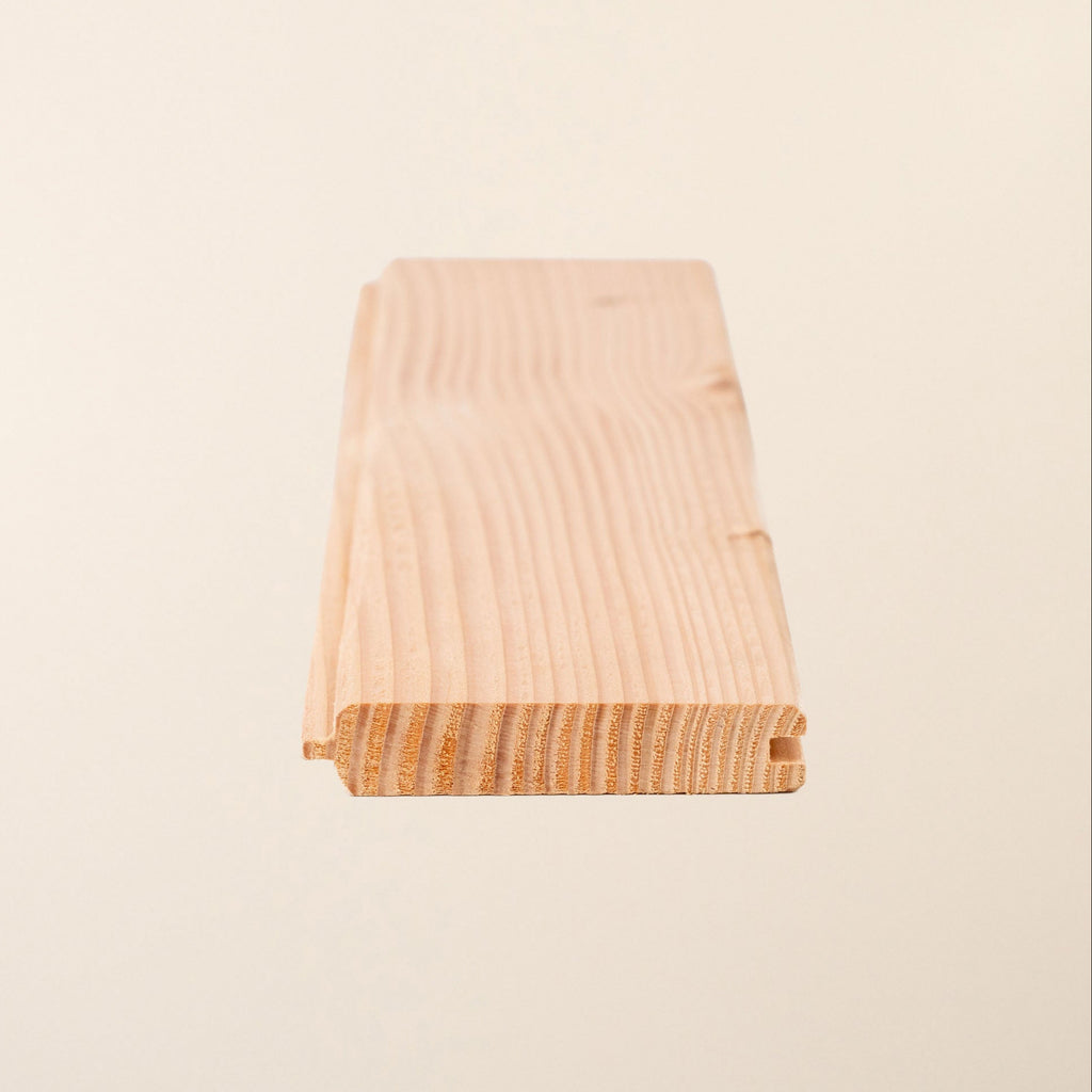 British Larch tongue and groove boards, 95mm x 19mm, showing natural wood grain and smooth planed surface 