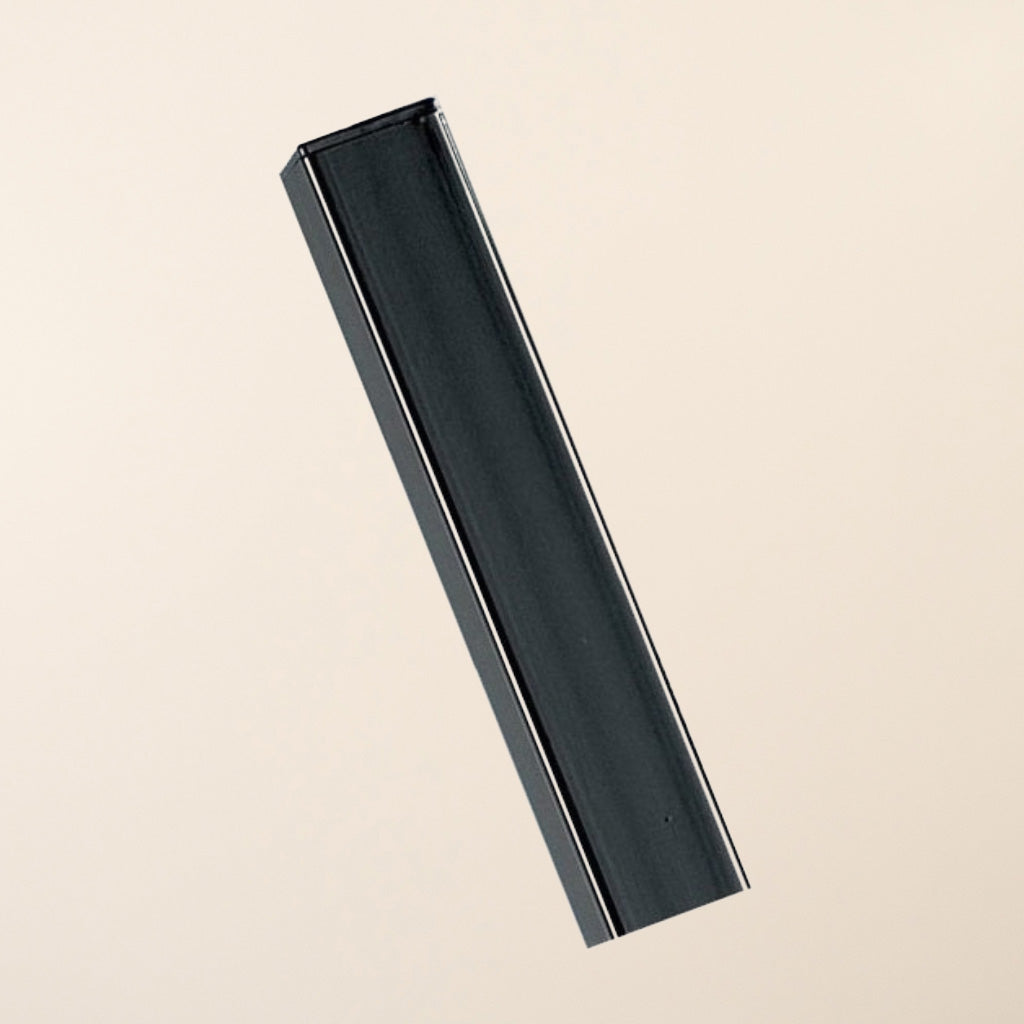 In-ground flat top metal gate post showing full length view of sturdy black metal construction 