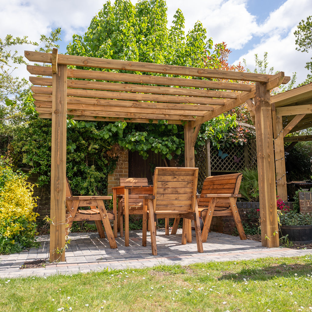 Wooden pergola with flat open roof in garden setting, perfect for outdoor dining and entertainment 