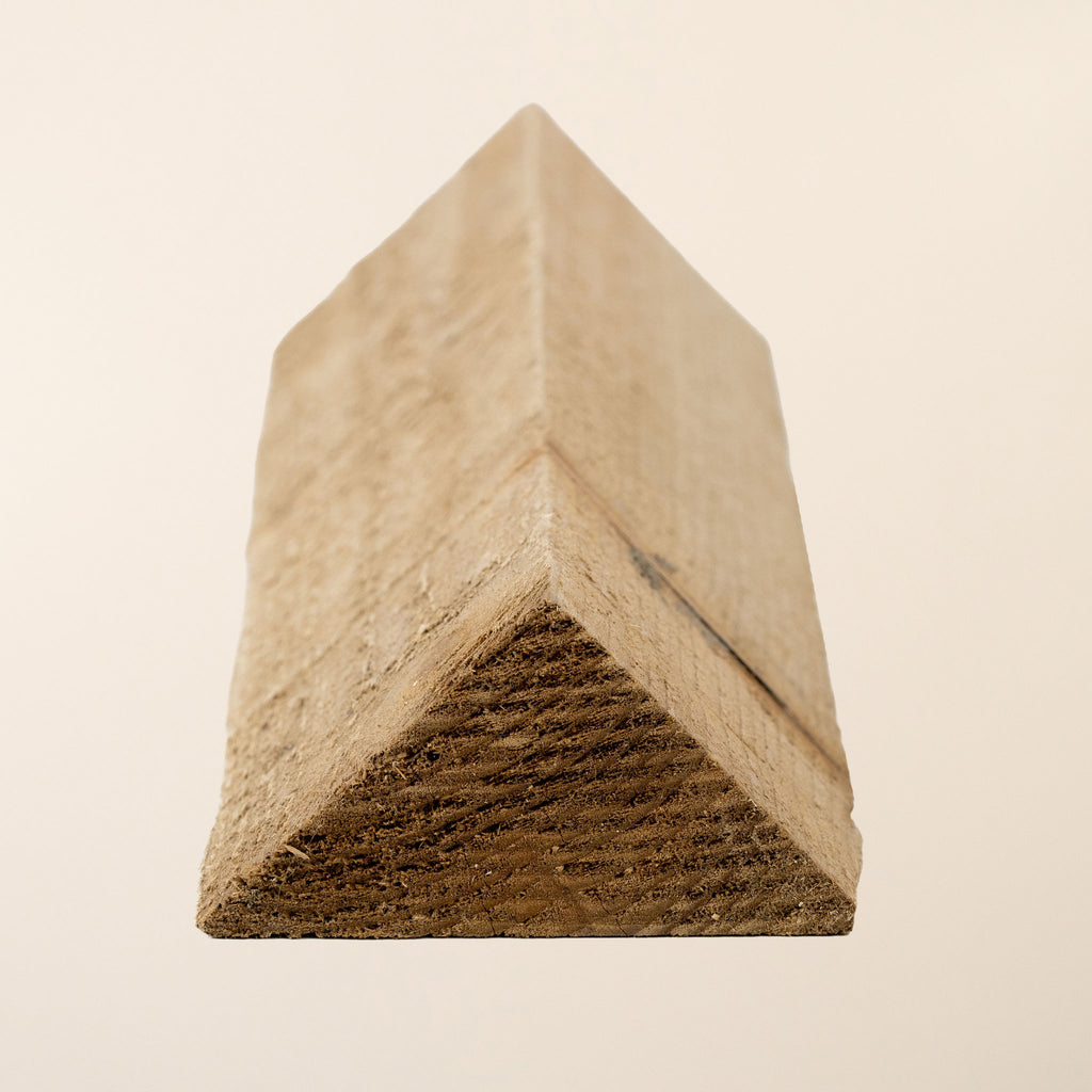 Pressure treated arris rail timber measuring 75mm x 106mm with distinctive triangular profile, featuring rough sawn finish and green tanalith treatment, available in lengths from 1.8m to 3.6m for fencing and agricultural applications 