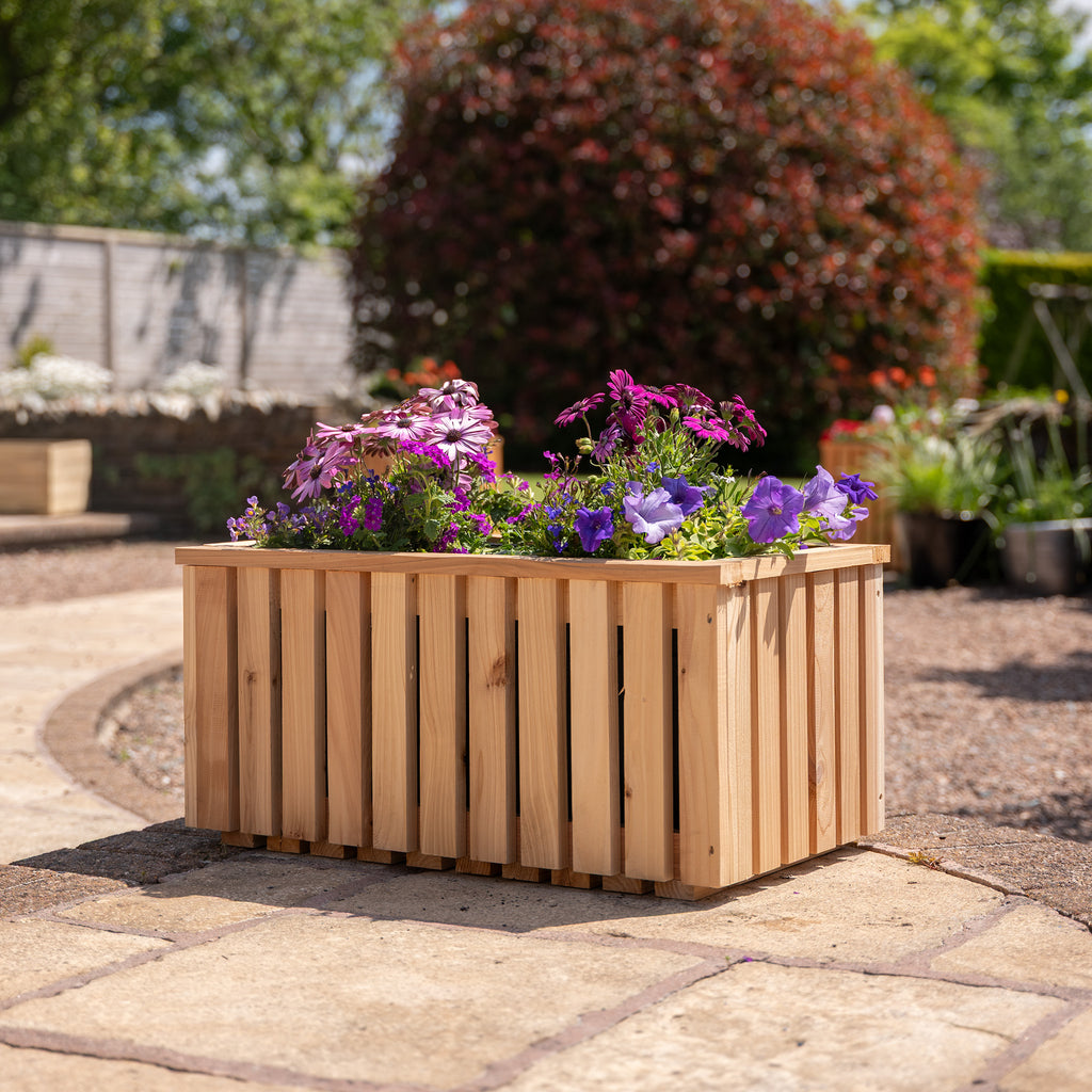 Front lifestyle shot of slatted garden planter 