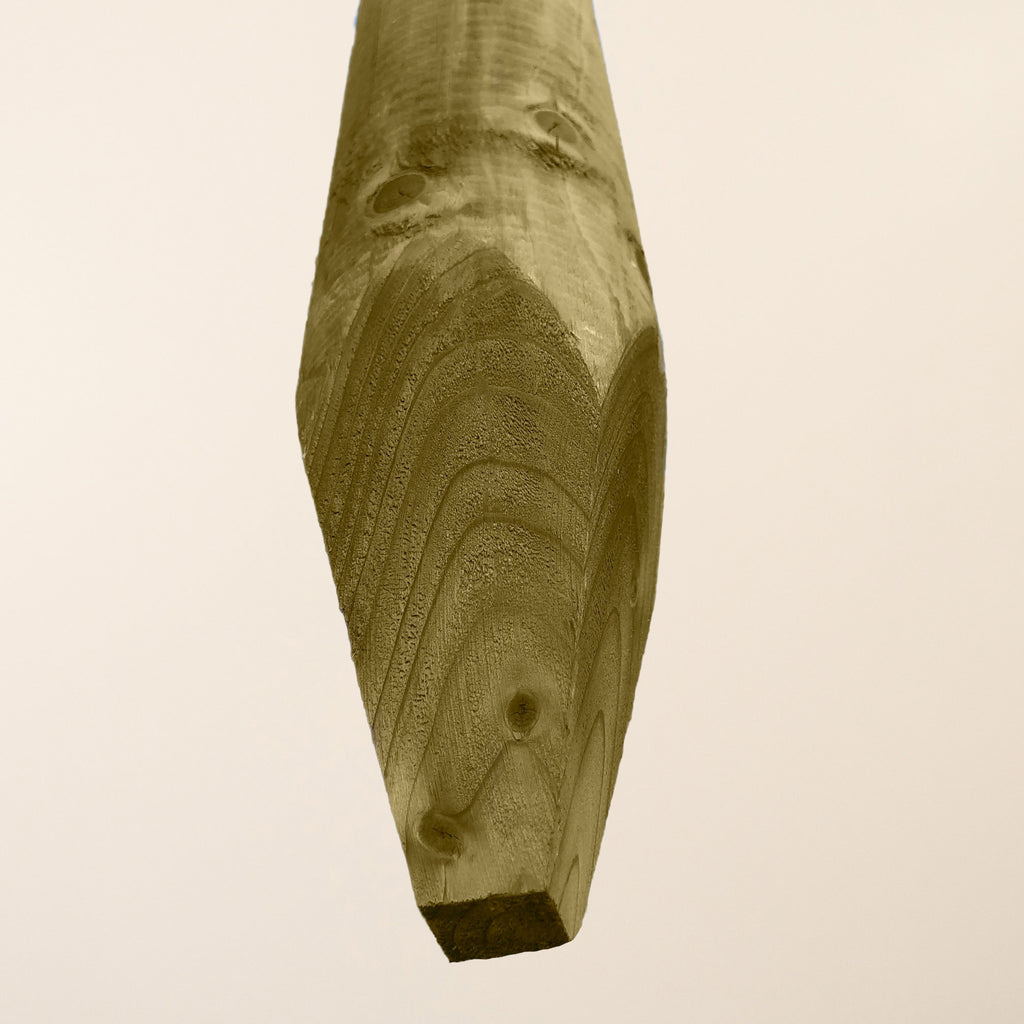 Thick round wooden fence post with smooth machined finish, 100mm diameter, showing green pressure treatment for outdoor durability 